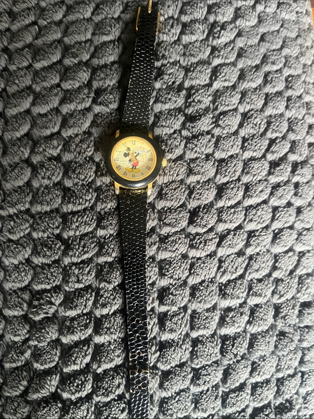 Vintage Disney Women's Black Strap Watch with Gold Tone Case and Character Dial